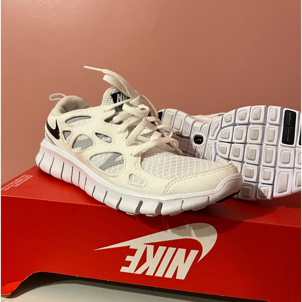 Nike free run 2 in white. Size 5 men’s and 6.5 women’s.